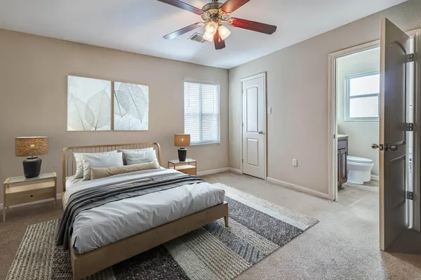 a bedroom with bed and window