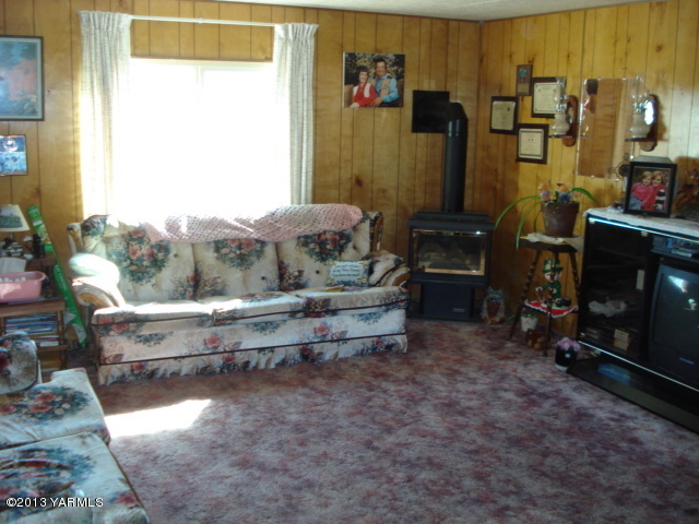 16692 Ahtanum Road Yakima, WA 98903 - Photo 6 of 7 a room with lots of furniture and a fireplace