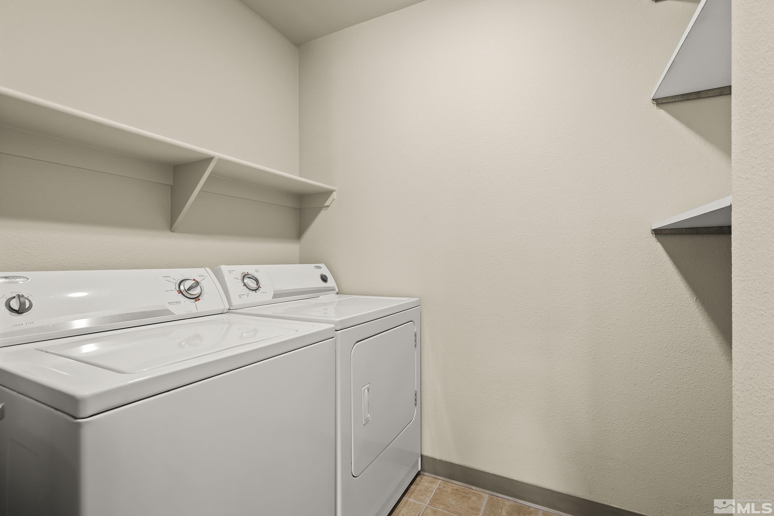6850 Sharlands Avenue, Unit M1077 Reno, NV 89523 - Photo 14 of 27 a utility room with dryer and washer