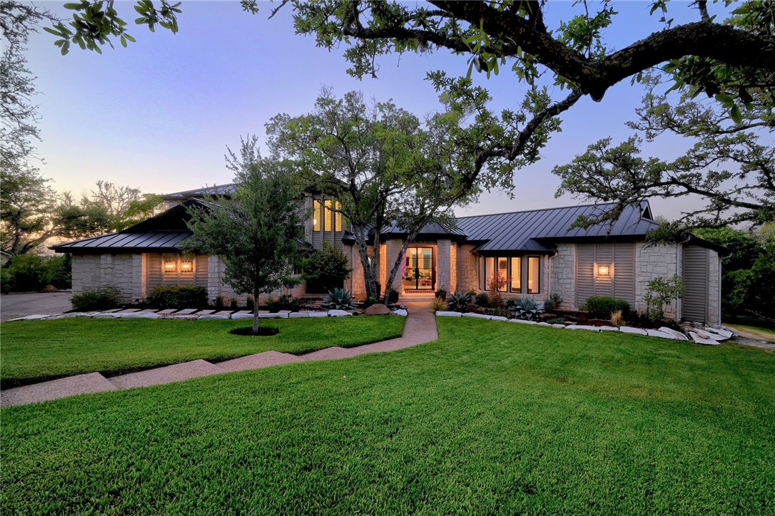 a view of a house with a yard porch and sitting area