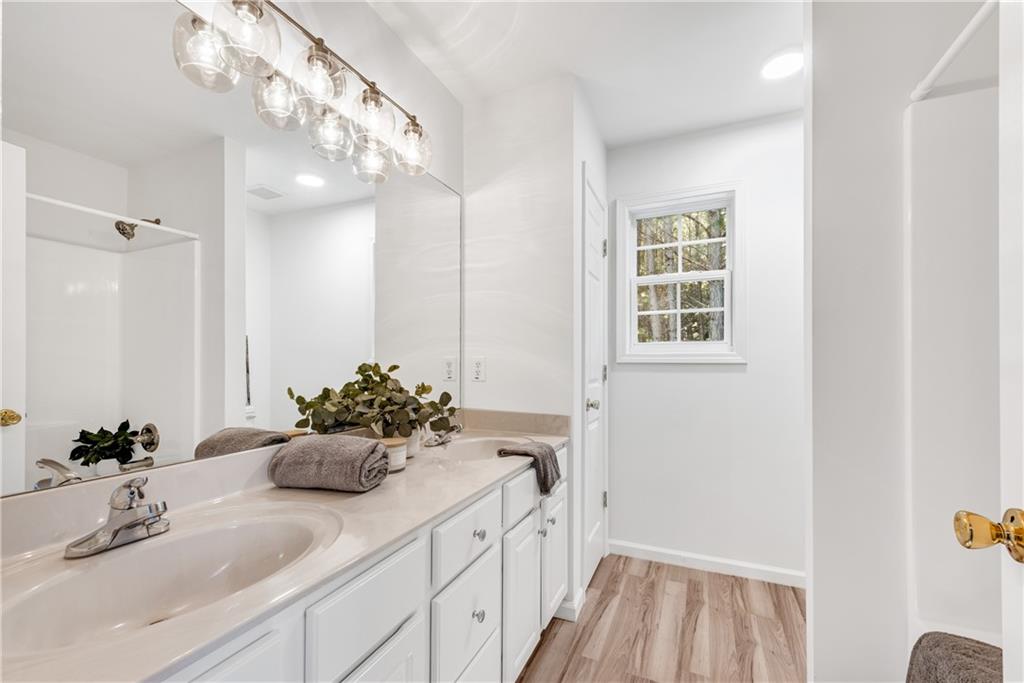 125 Pine Ridge Trace Athens, GA 30605 - Photo 15 of 28 a bathroom with a sink a vanity and a mirror