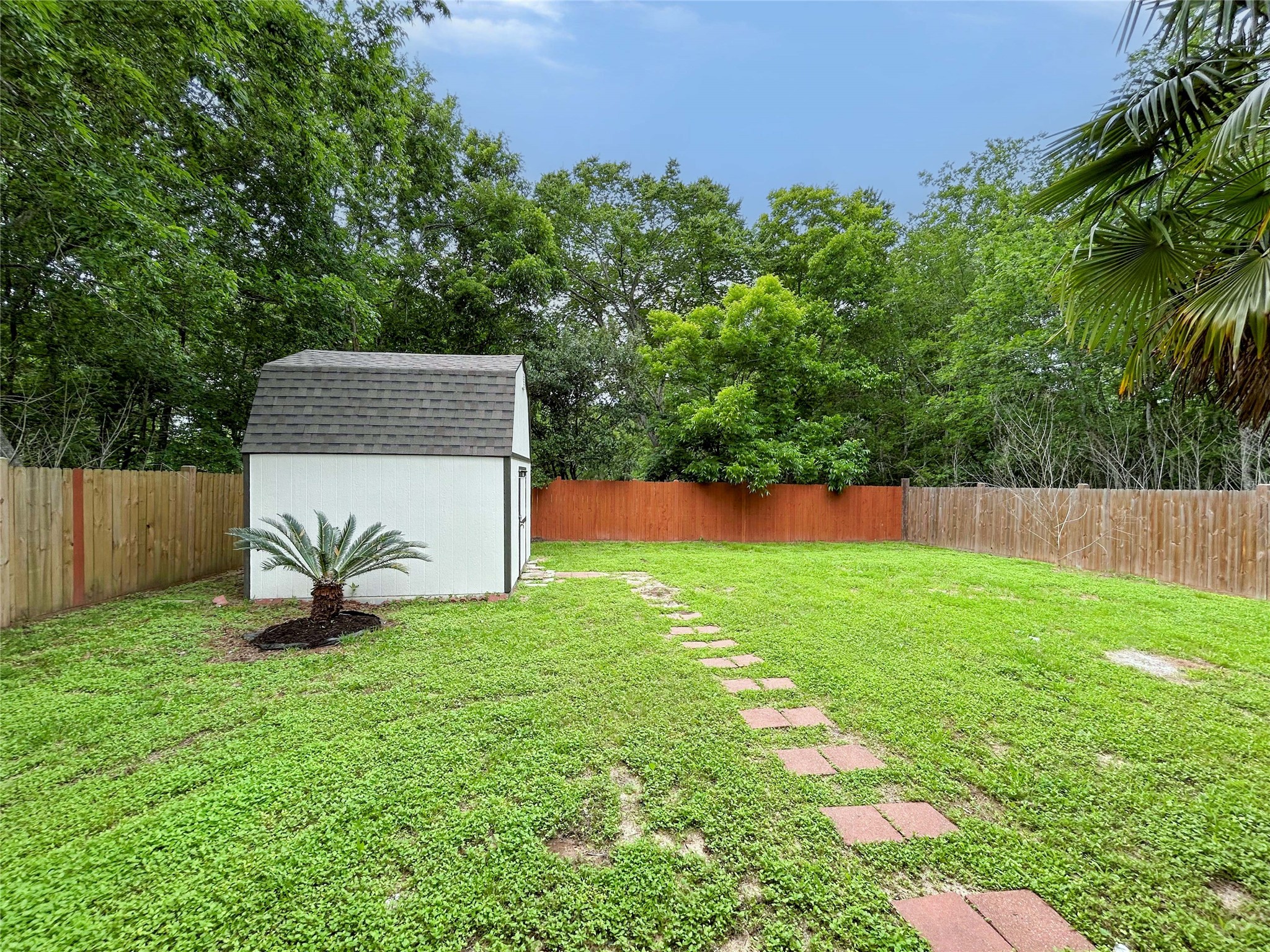 7902 Masters Manvel, TX 77578 - Photo 4 of 21 The home has a spacious backyard as well as a shed which also has a new roof and new exterior paint.