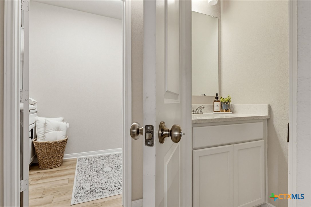1761 Spence Street Temple, TX 76502 - Photo 13 of 30 a bathroom with a sink and a mirror