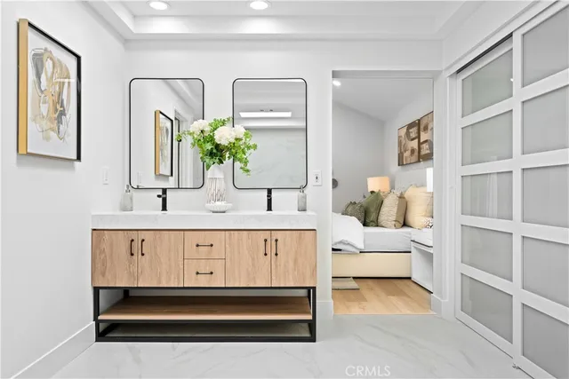 a view of a workspace with furniture and wooden floor