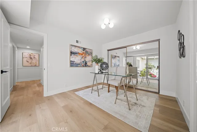 a view of a livingroom with couch and cabinet