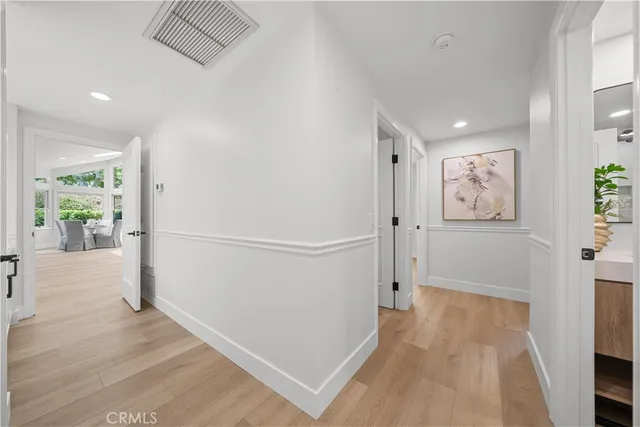 a kitchen with stainless steel appliances a refrigerator and cabinets