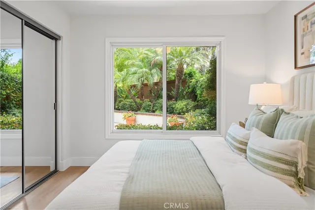 a bed room with bed and a window