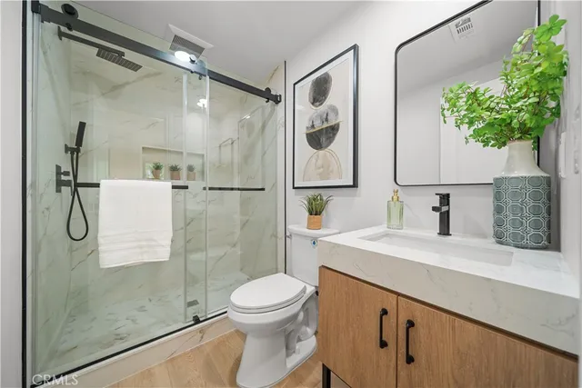 a spacious bedroom with a bed and window