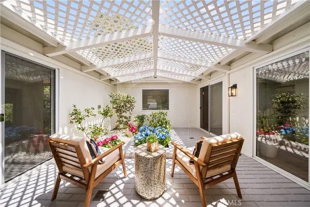 a view of a patio with furniture