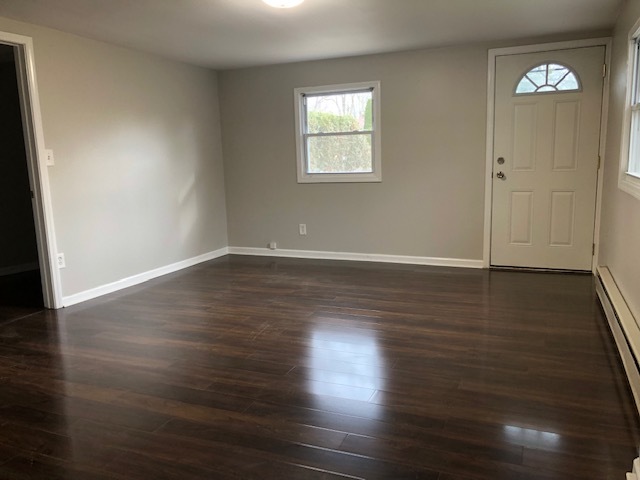 41 Golfview Road Lake Zurich, IL 60047 - Photo 9 of 12 an empty room with wooden floor and windows
