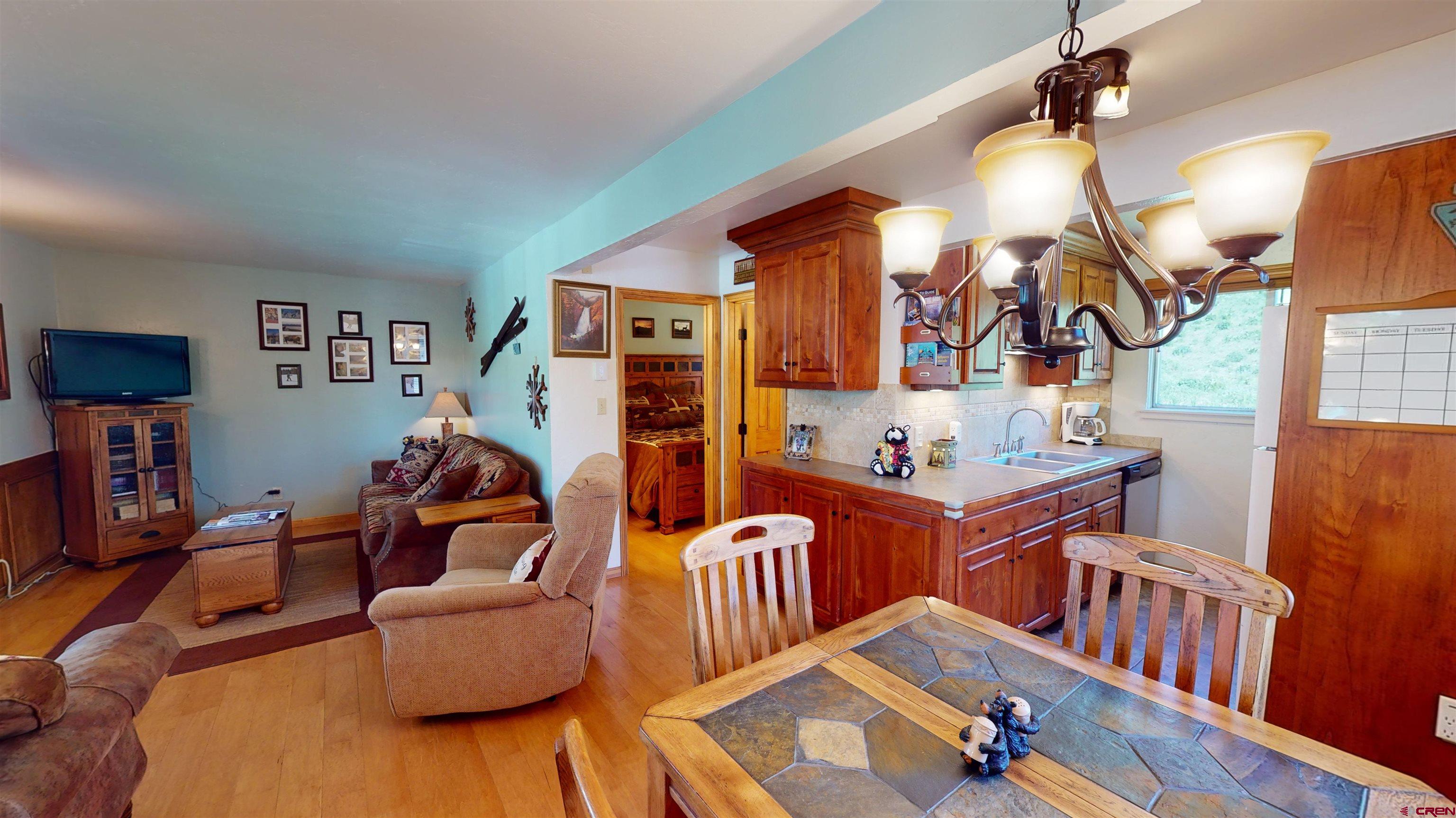 18 Crystal Road, Unit 3B Crested Butte, CO 81225 - Photo 6 of 20 a living room with furniture and a flat screen tv