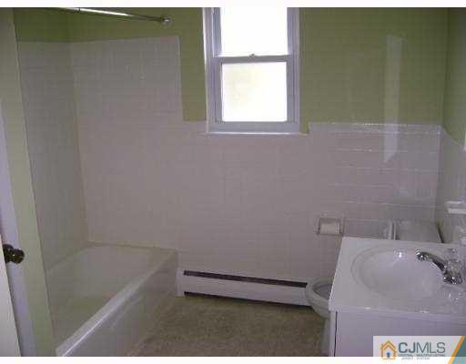 72 Fox Road, Unit 3B Edison, NJ 08817 - Photo 5 of 5 a bathroom with a sink and a bathtub