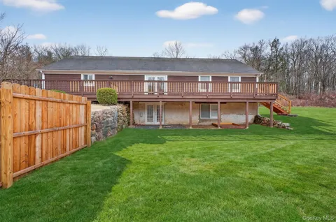 a view of a yard in front of a house with a yard