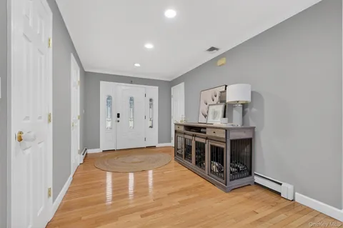 a view of a kitchen with stainless steel appliances a stove top oven
