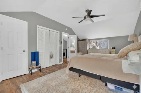a living room with a bed furniture and a window