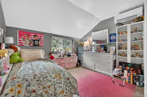a bedroom with a bed furniture and a window