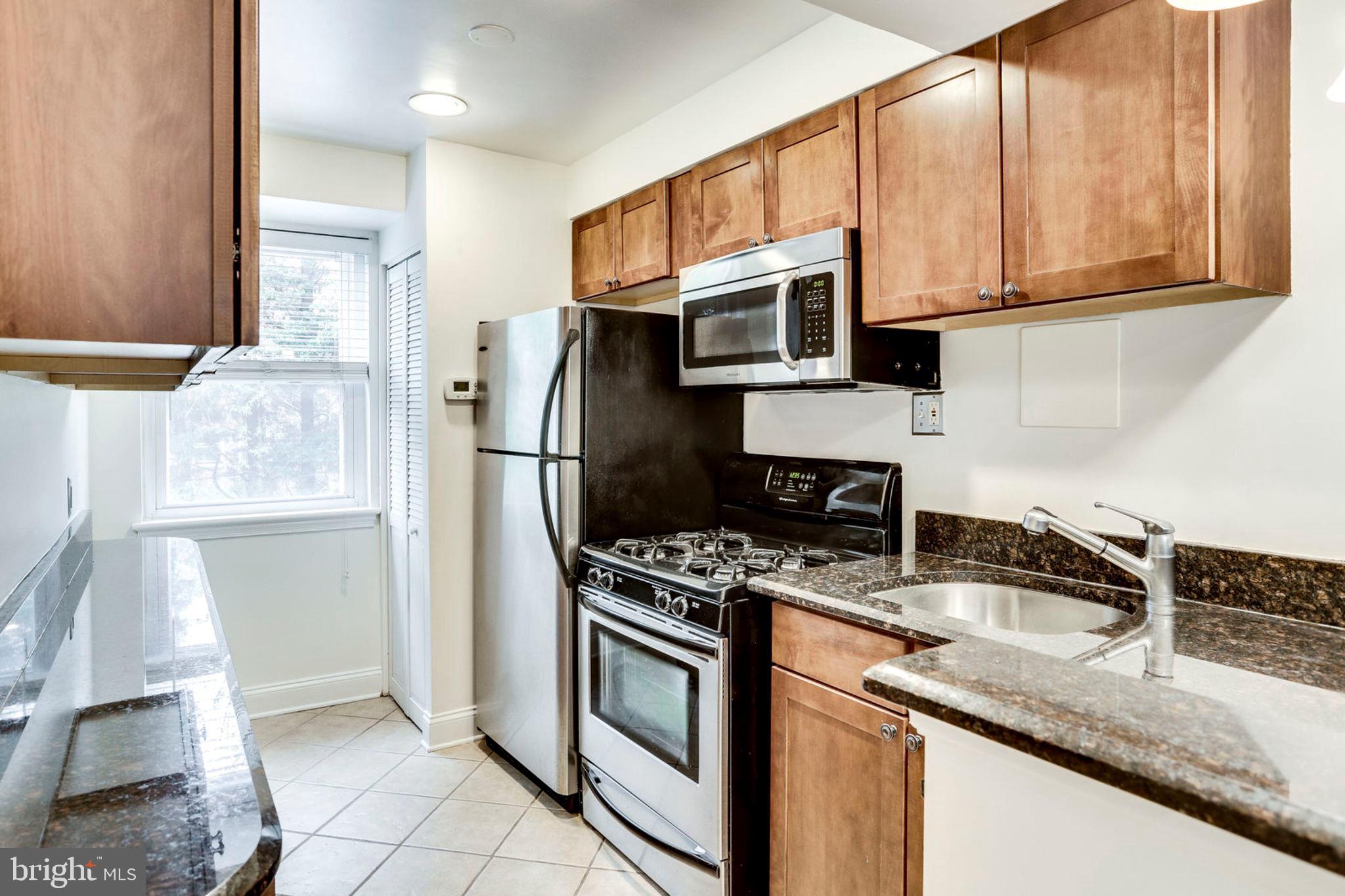 8708 Bradford Road, Unit 202 Silver Spring, MD 20901 - Photo 5 of 28 Galley Kitchen