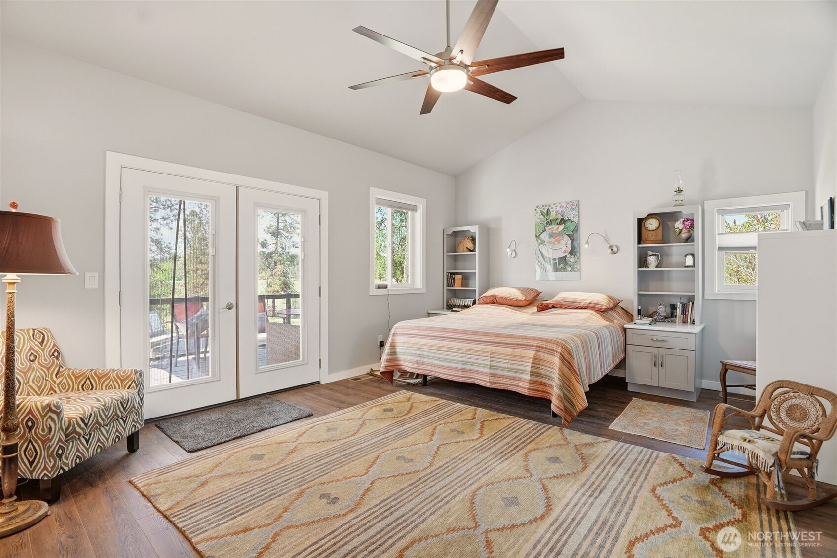 12119 South Spotted Road Cheney, WA 99004 - Photo 13 of 40 a bedroom with a bed a dresser and a window
