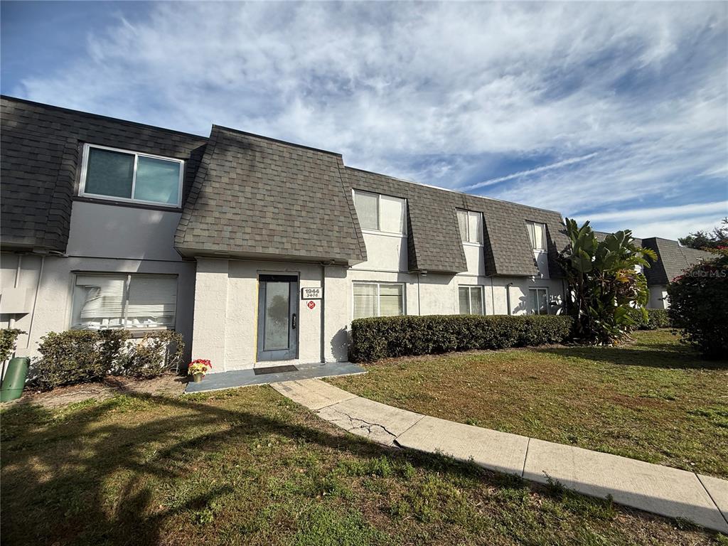 1944 South Conway Road, Unit 3 Orlando, FL 32812 - Photo 2 of 20 a front view of a house with garden