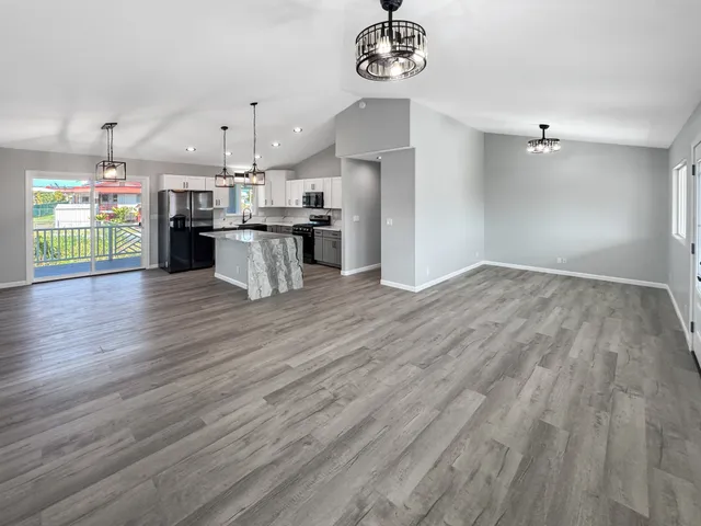 a view of kitchen and kitchen with a wooden floor