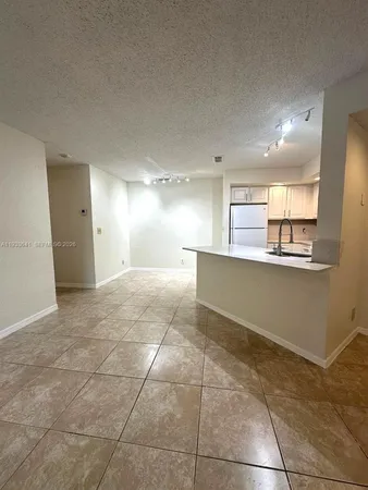 a view of a kitchen with a sink
