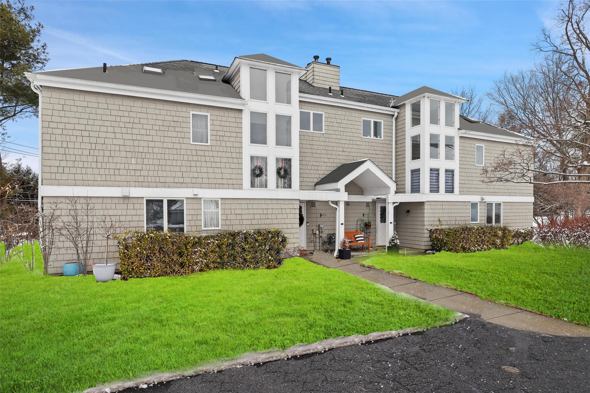 2 Kings Park Drive Rye Brook, NY 10573 - Photo 1 of 1 Rear view of property featuring a yard