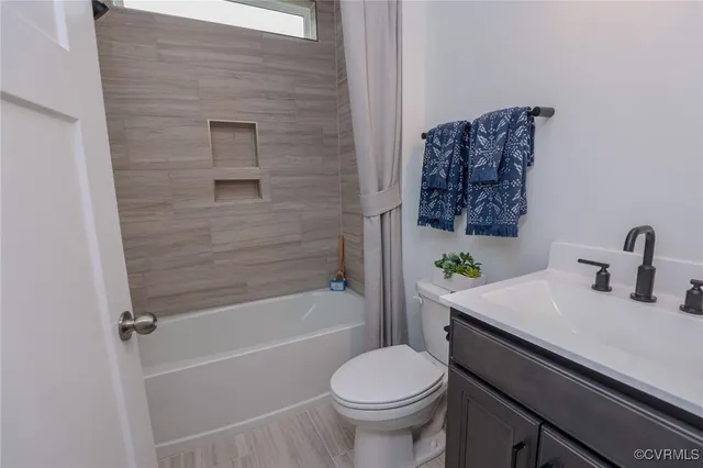 a living room with furniture or window and a wooden floor