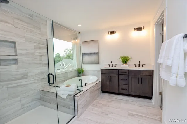a spacious bathroom with a double vanity sink and mirror