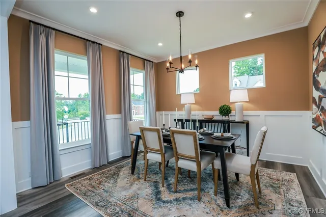 a view of a dining room with furniture window and wooden floor