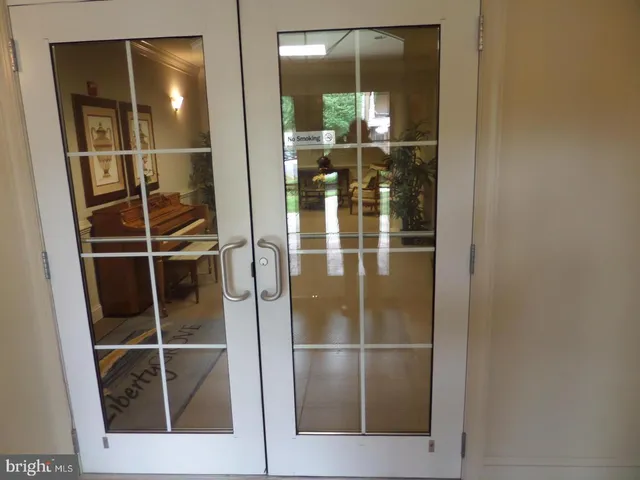 a bathroom with a glass shower door