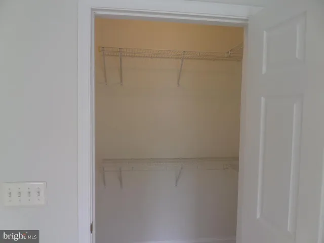 a white toilet sitting next to a bath tub