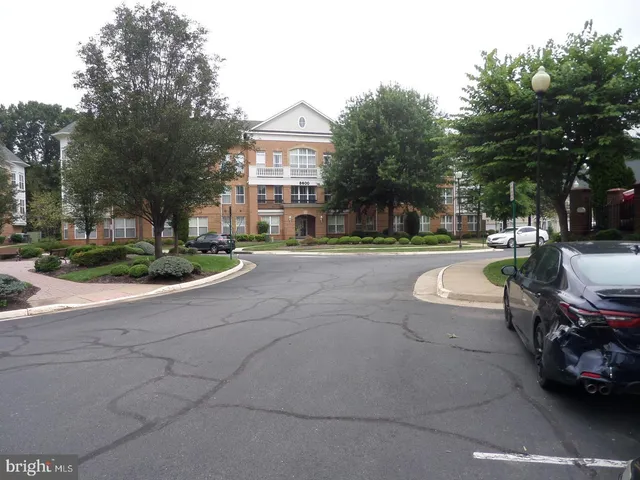 a view of a street with houses on both side