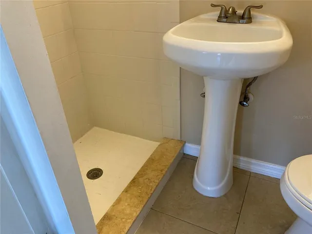a bathroom with a sink and toilet