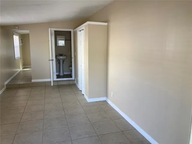 an empty room with entrance and door