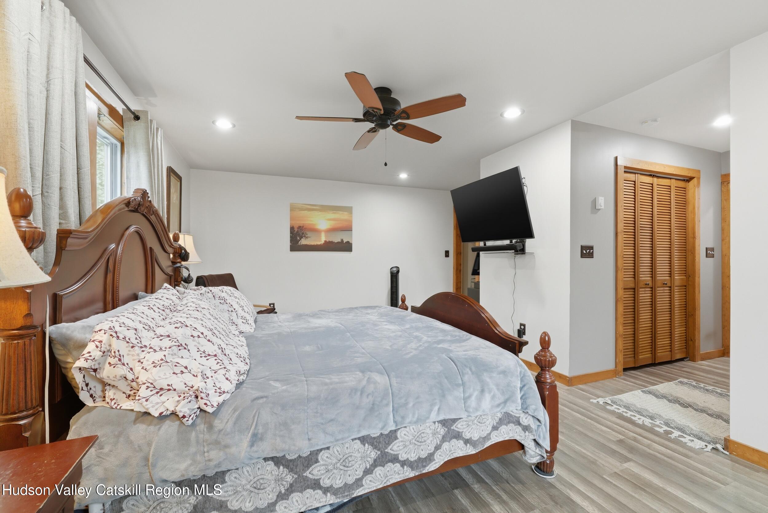 186 Cedar Hill Road High Falls, NY 12440 - Photo 21 of 33 a bedroom with a bed and a flat screen tv