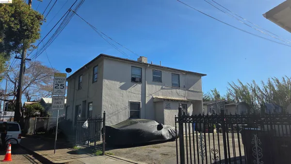 a front view of a house with parking space