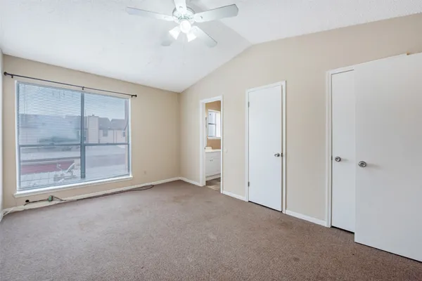 a bathroom with a bathtub shower sink vanity and toilet