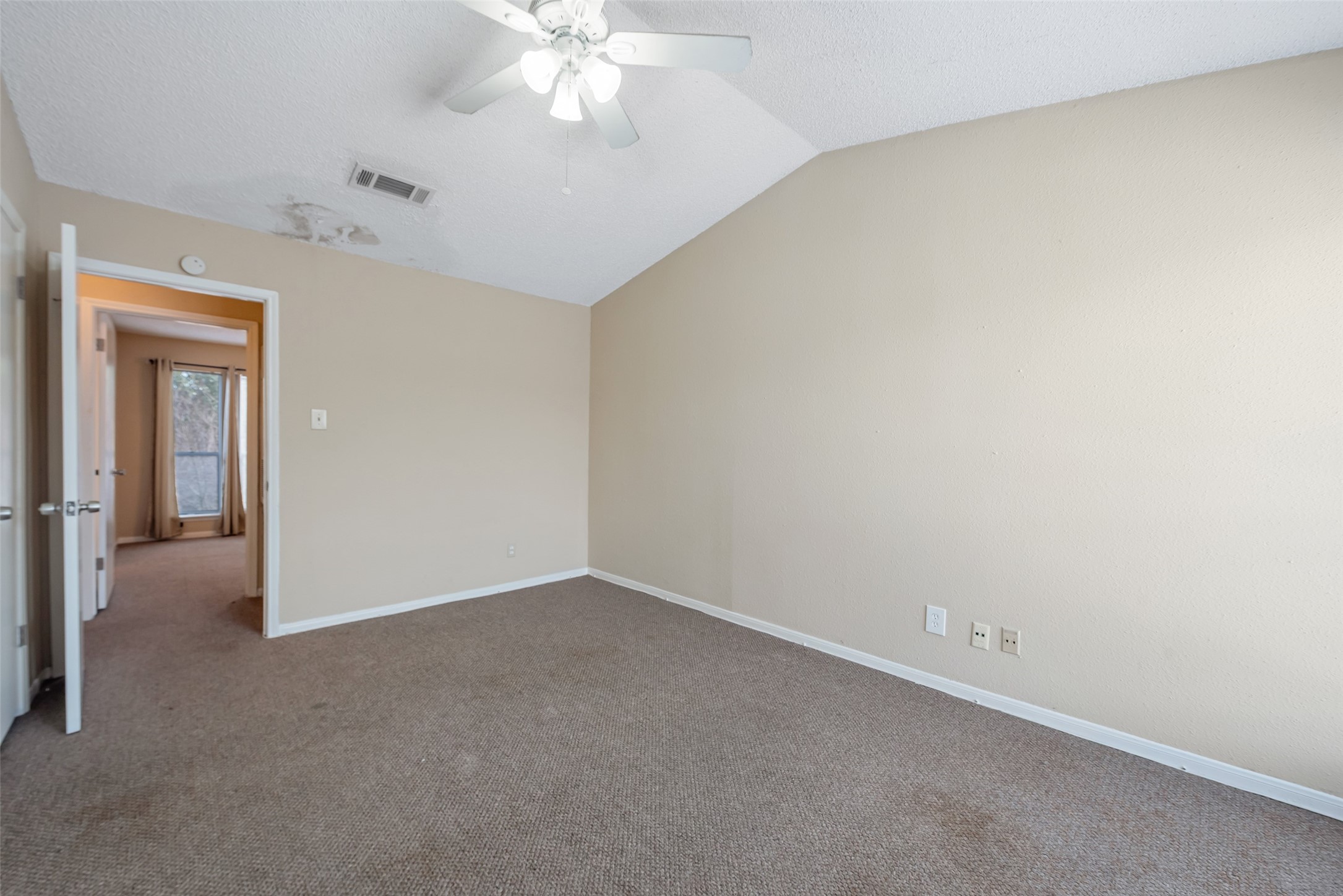12400 Brookglade Circle, Unit 15 Houston, TX 77099 - Photo 24 of 43 an empty room with a chandelier fan