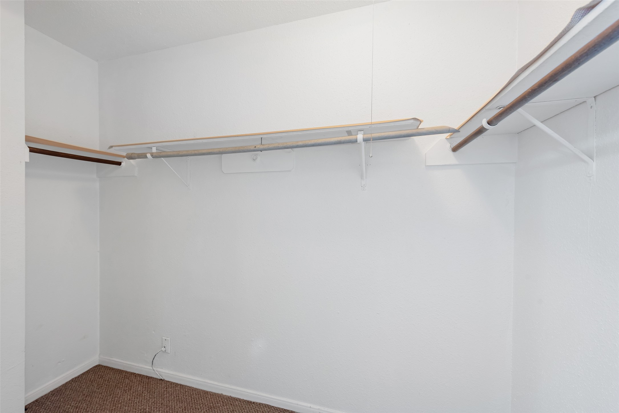 12400 Brookglade Circle, Unit 15 Houston, TX 77099 - Photo 26 of 43 a view of an empty walk in closet