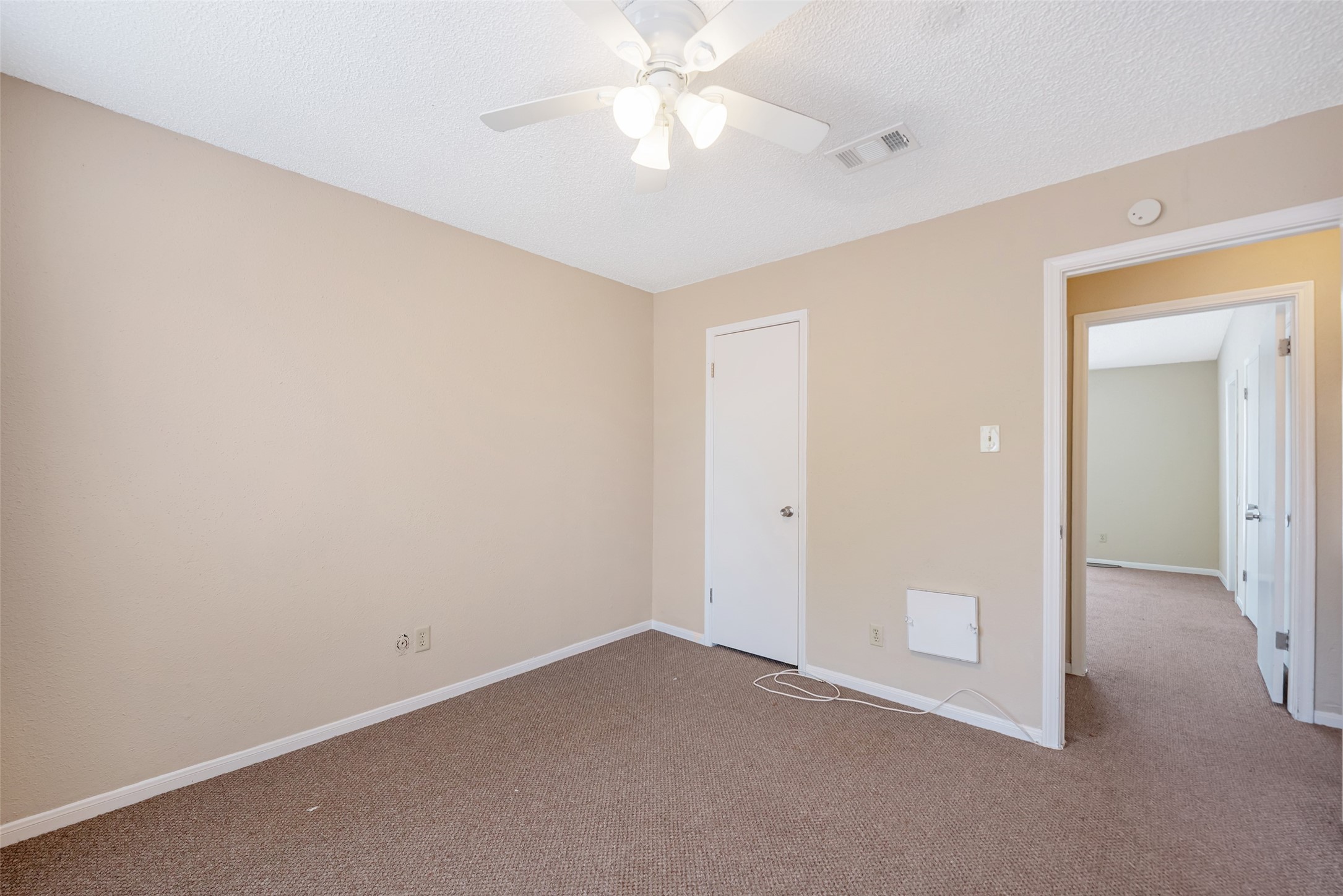 12400 Brookglade Circle, Unit 15 Houston, TX 77099 - Photo 28 of 43 an empty room with a ceiling fan and a fan