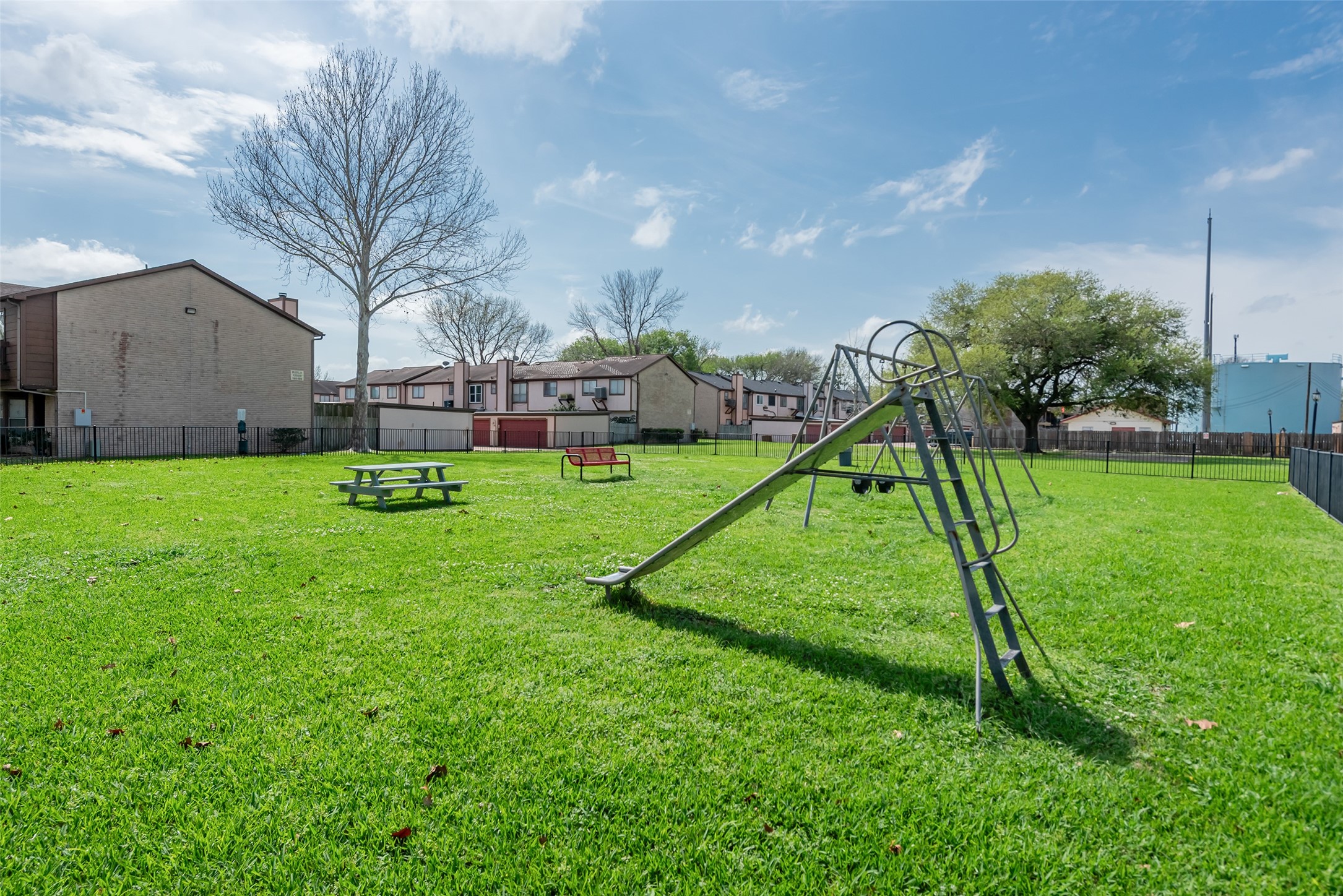 12400 Brookglade Circle, Unit 15 Houston, TX 77099 - Photo 38 of 43 a view of a house with a backyard and a slide
