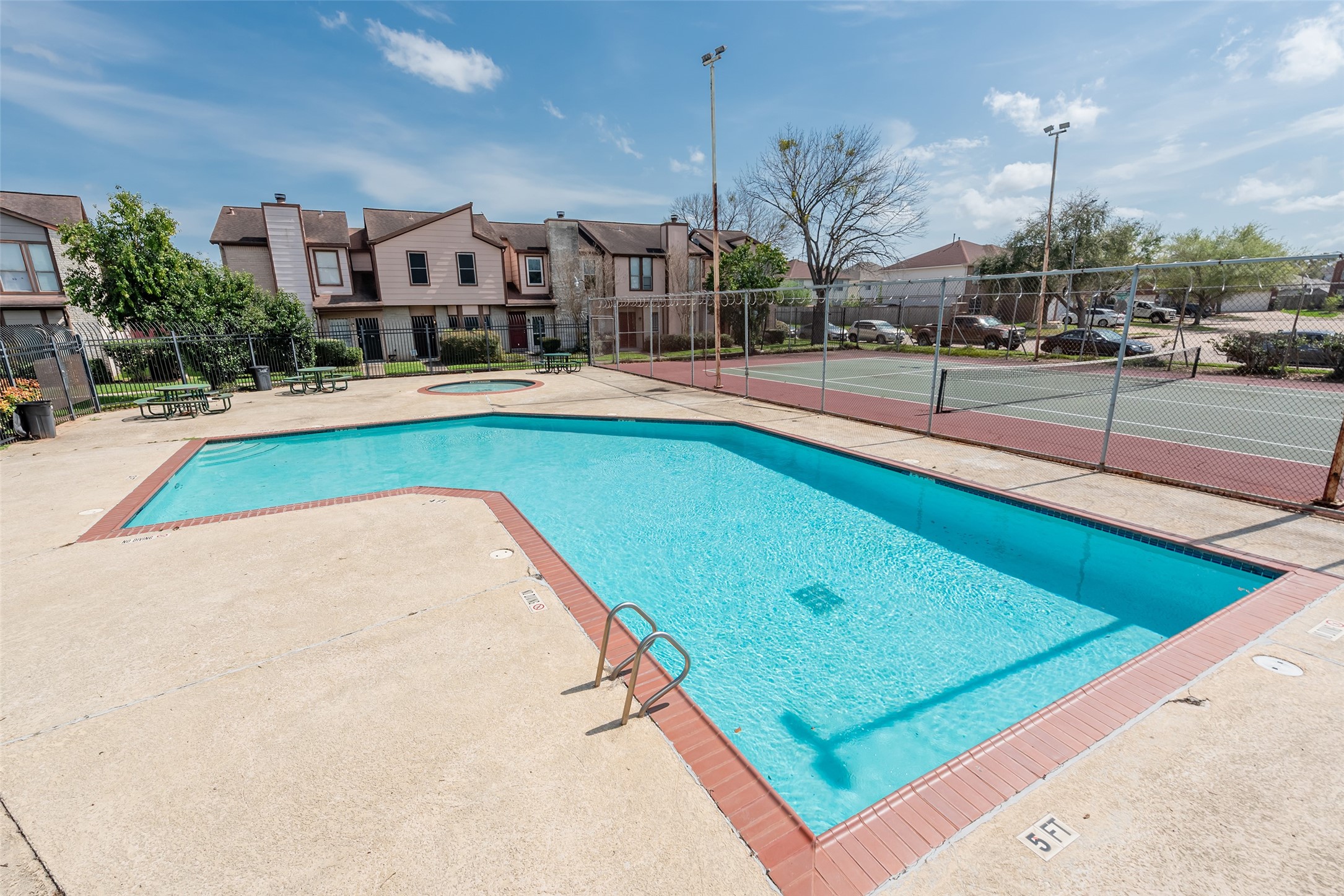 12400 Brookglade Circle, Unit 15 Houston, TX 77099 - Photo 41 of 43 a view of swimming pool with outdoor seating and a yard