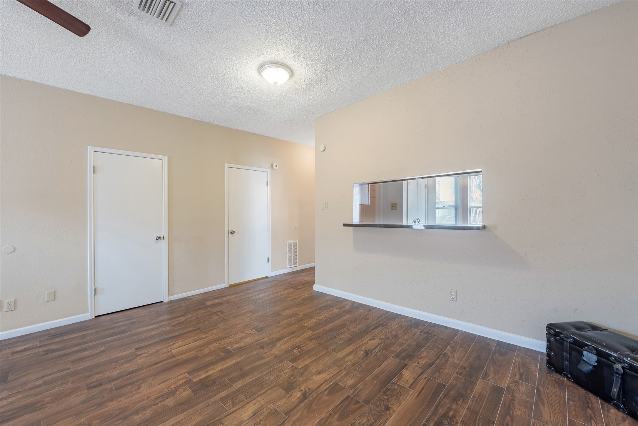12400 Brookglade Circle, Unit 15 Houston, TX 77099 - Photo 7 of 43 a view of a room with wooden floor and white walls