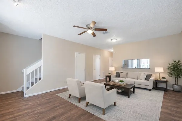 wooden floor fireplace and natural light in room
