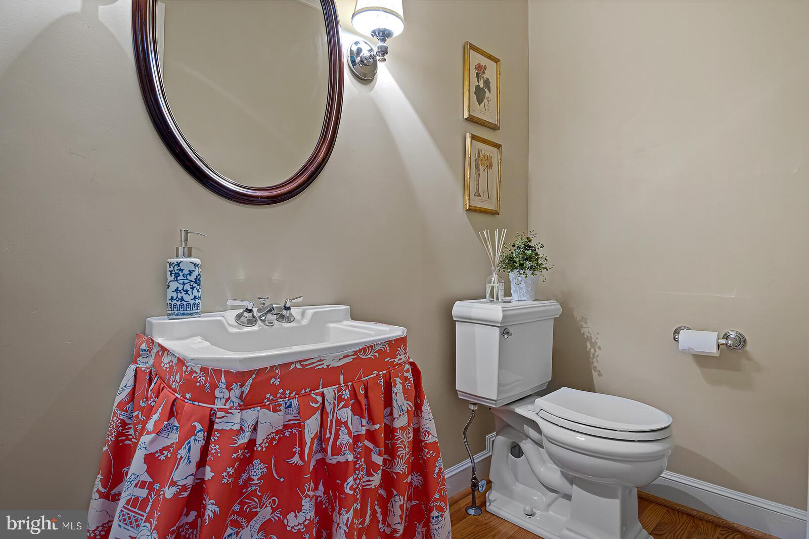 106 Edgewood Road Wilmington, DE 19803 - Photo 11 of 25 a bathroom with a sink a toilet and a mirror
