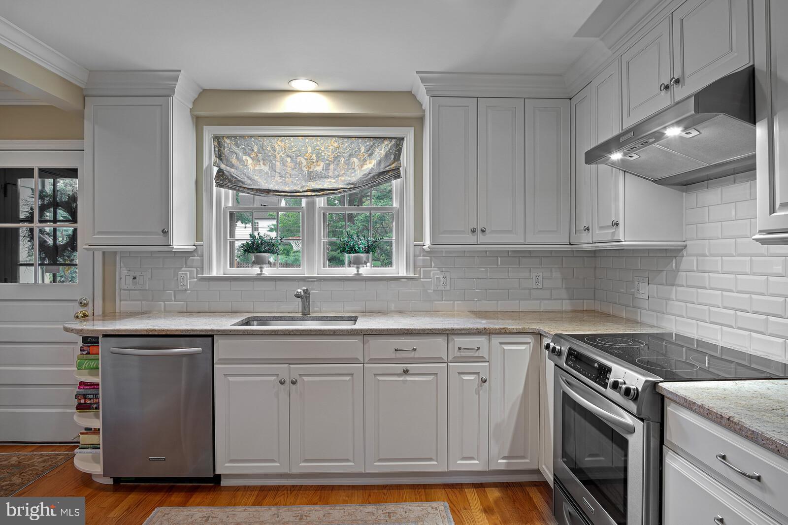 106 Edgewood Road Wilmington, DE 19803 - Photo 14 of 25 a kitchen with a sink stove and cabinets