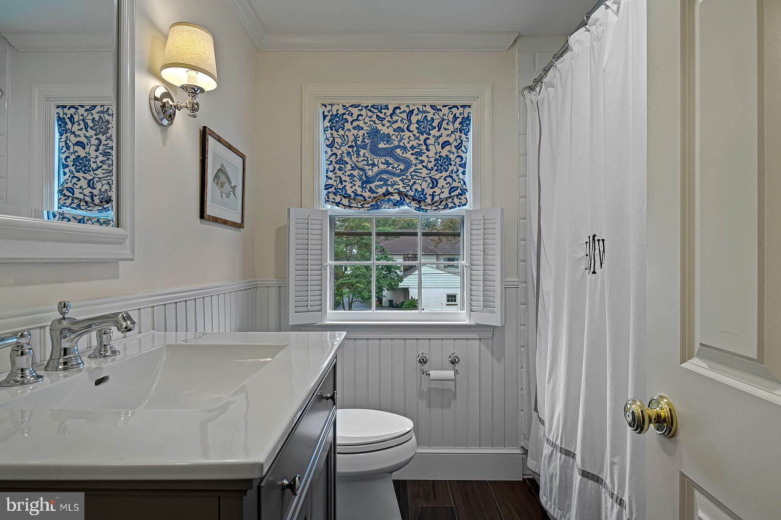 106 Edgewood Road Wilmington, DE 19803 - Photo 16 of 25 a bathroom with a sink a toilet and a mirror