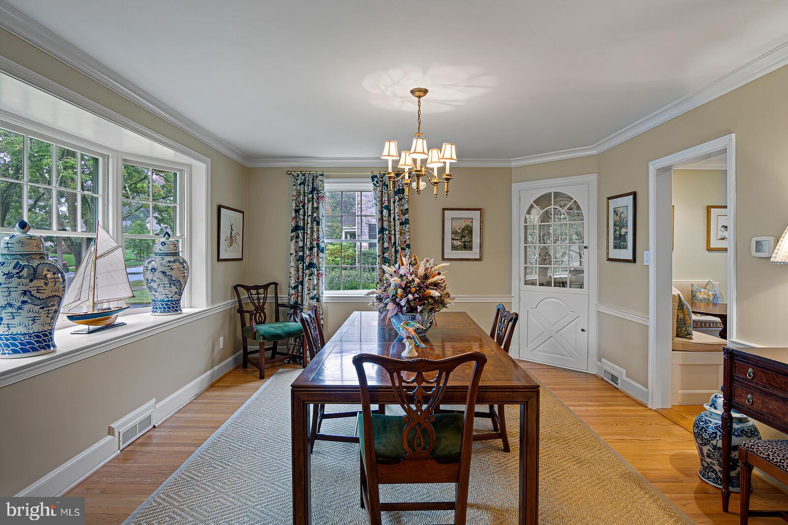 106 Edgewood Road Wilmington, DE 19803 - Photo 9 of 25 a view of a dining room with furniture and chandelier