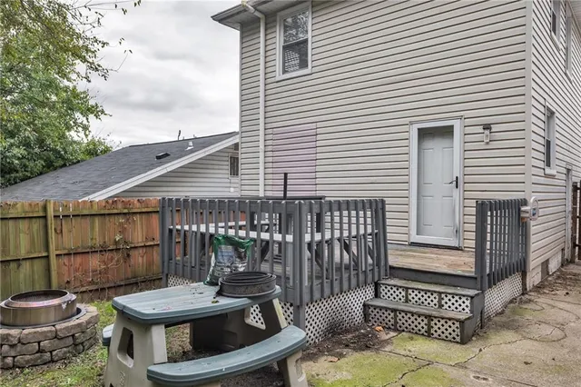 a view of a patio with a table and chairs