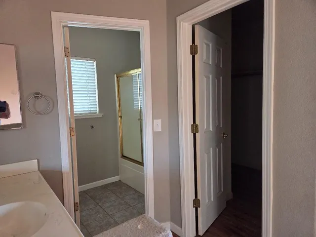 a view of a livingroom and a bathroom